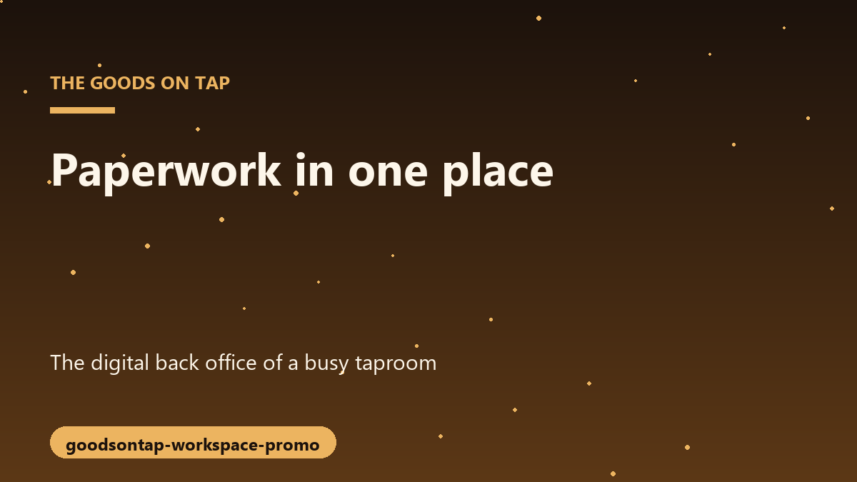 A brewery owner reviewing paperwork on a laptop surrounded by barrels